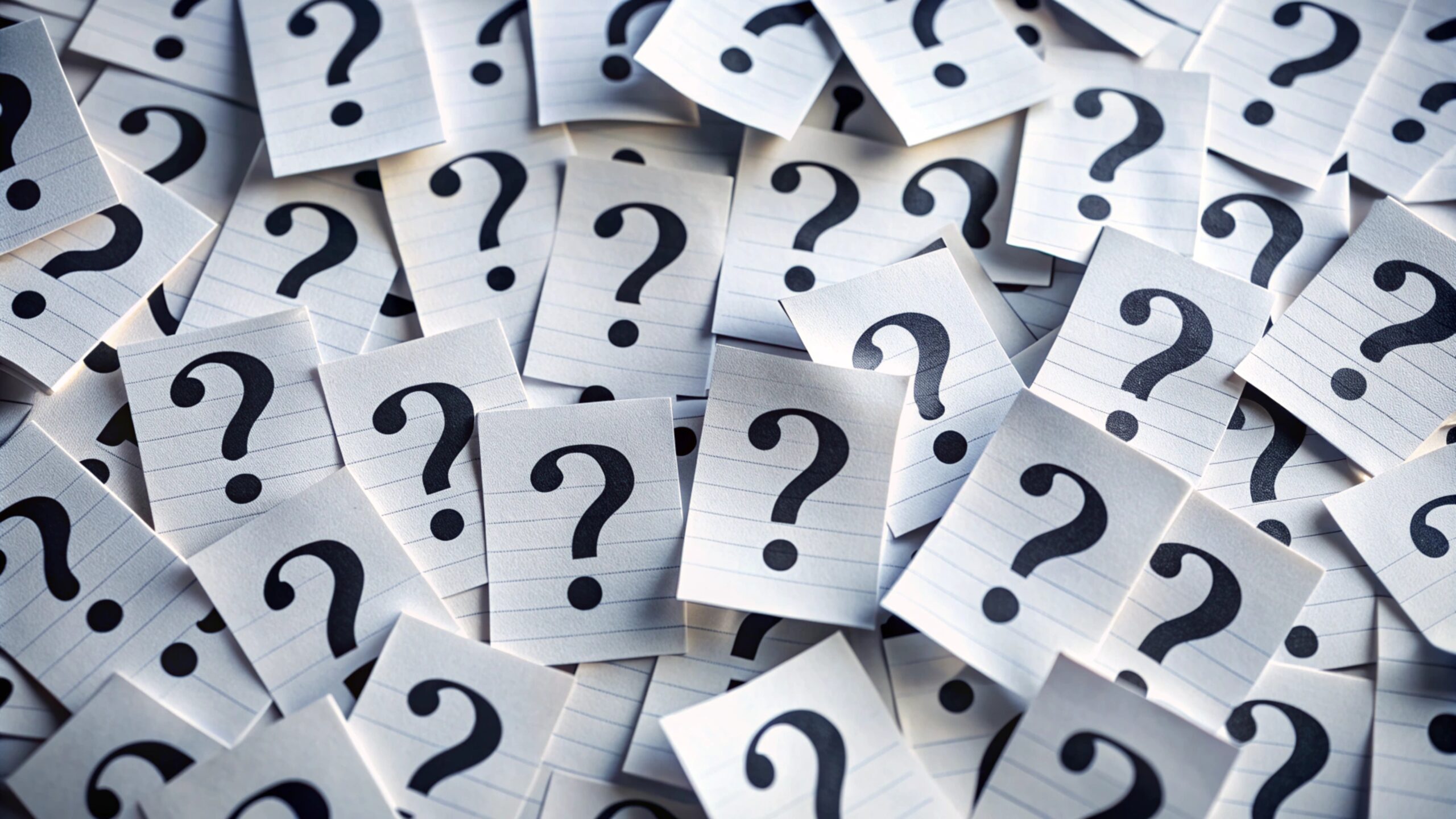 large-pile-white-papers-with-question-marks-them